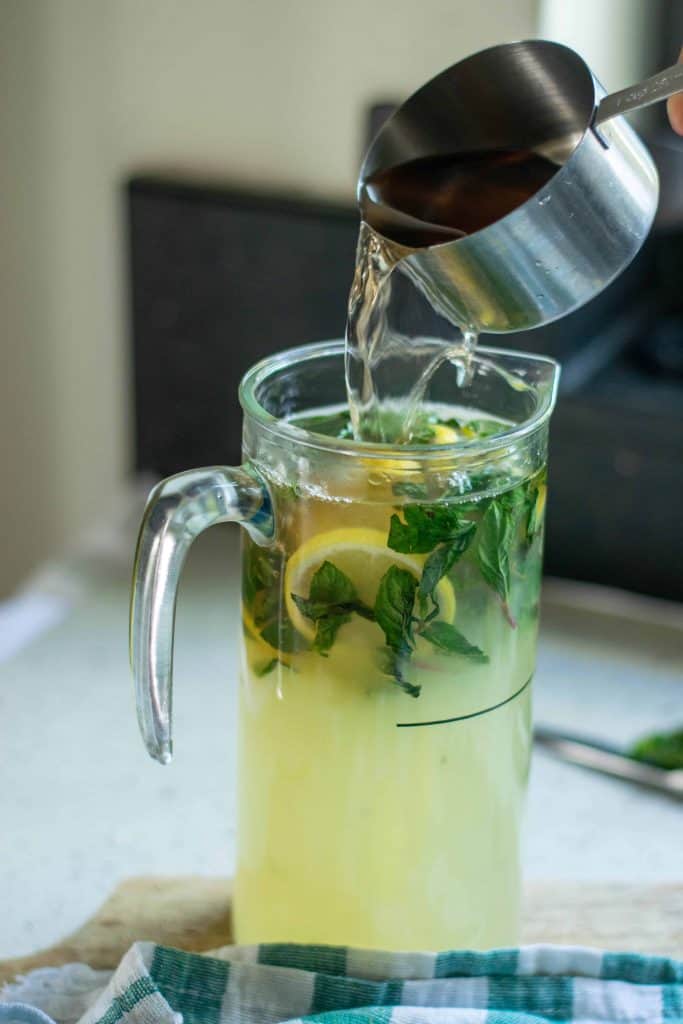 Cranberry Lemon Iced Tea with rum being poured into it.