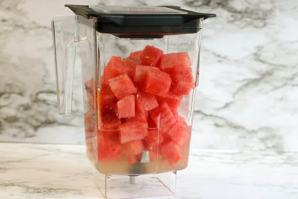 Watermelon chunks in a blender.