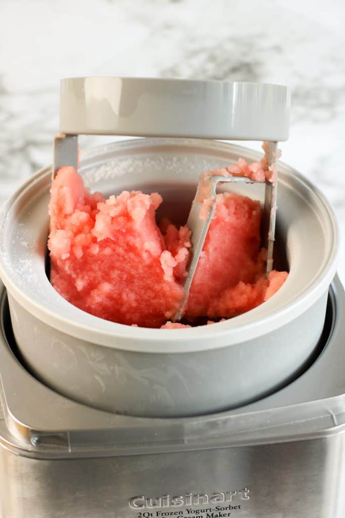 Watermelon sorbet in ice cream maker.