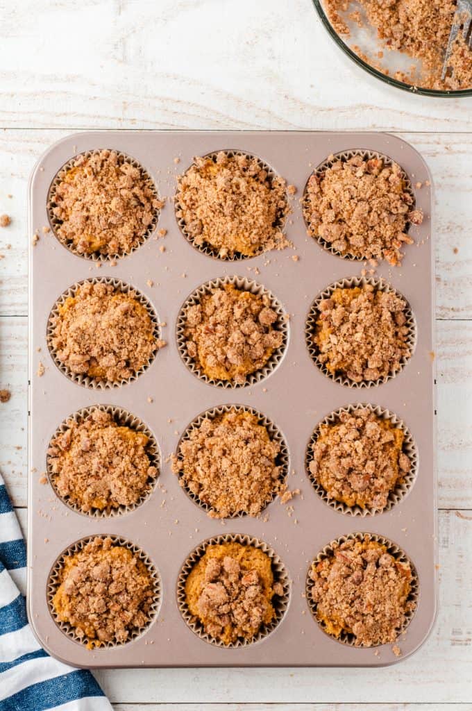 Whole wheat pumpkin muffins in a tin muffin pan ready to go in the. oven.