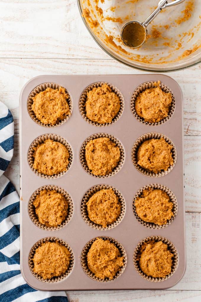 Whole wheat pumpkin muffin better in muffin tin ready to go in the oven.