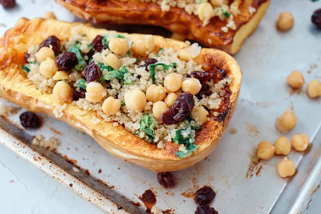 closeup of butternut squash with quinoa, chickpeas and dried cranberries.