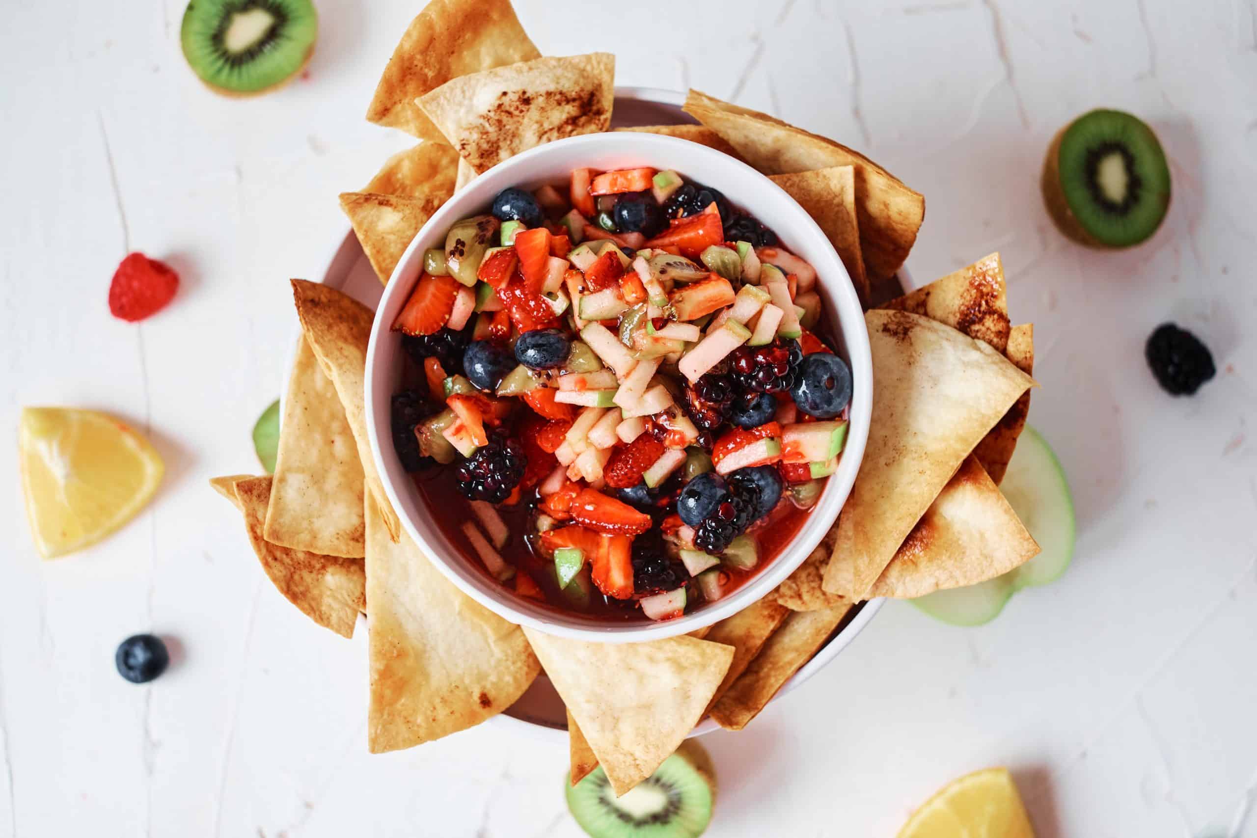 Overhead shot of fruit salsa and cinnamon chips.