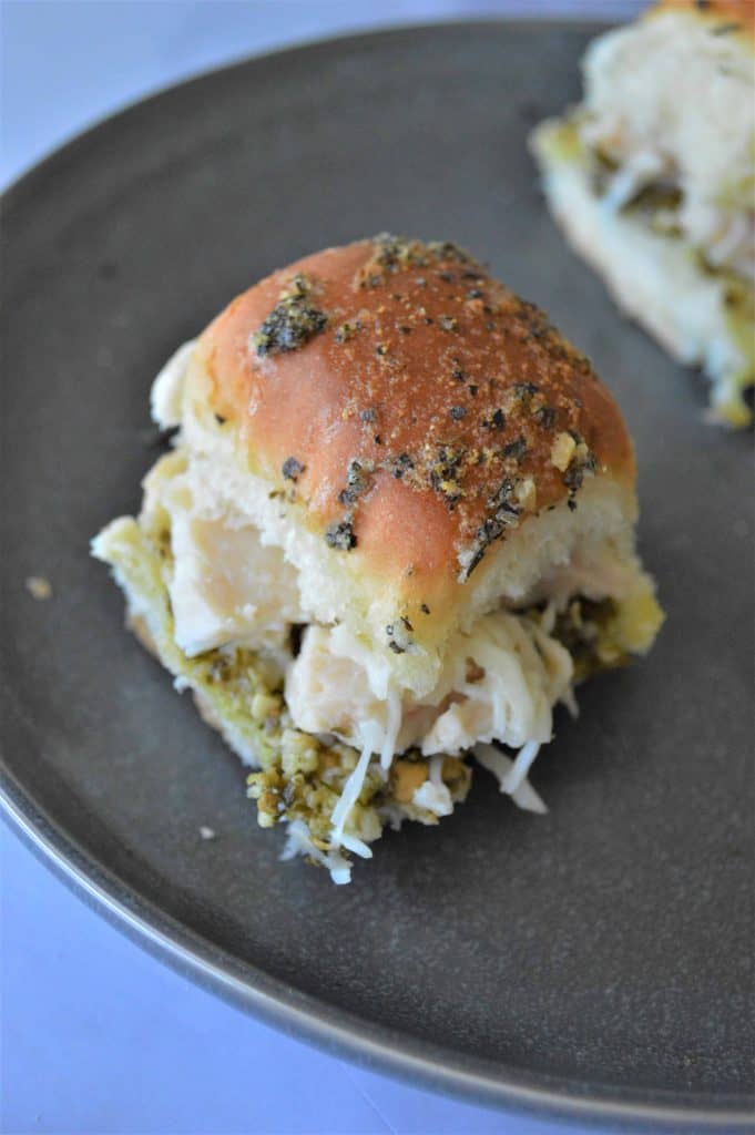 Overhead shot of chicken slider on a brown plate.