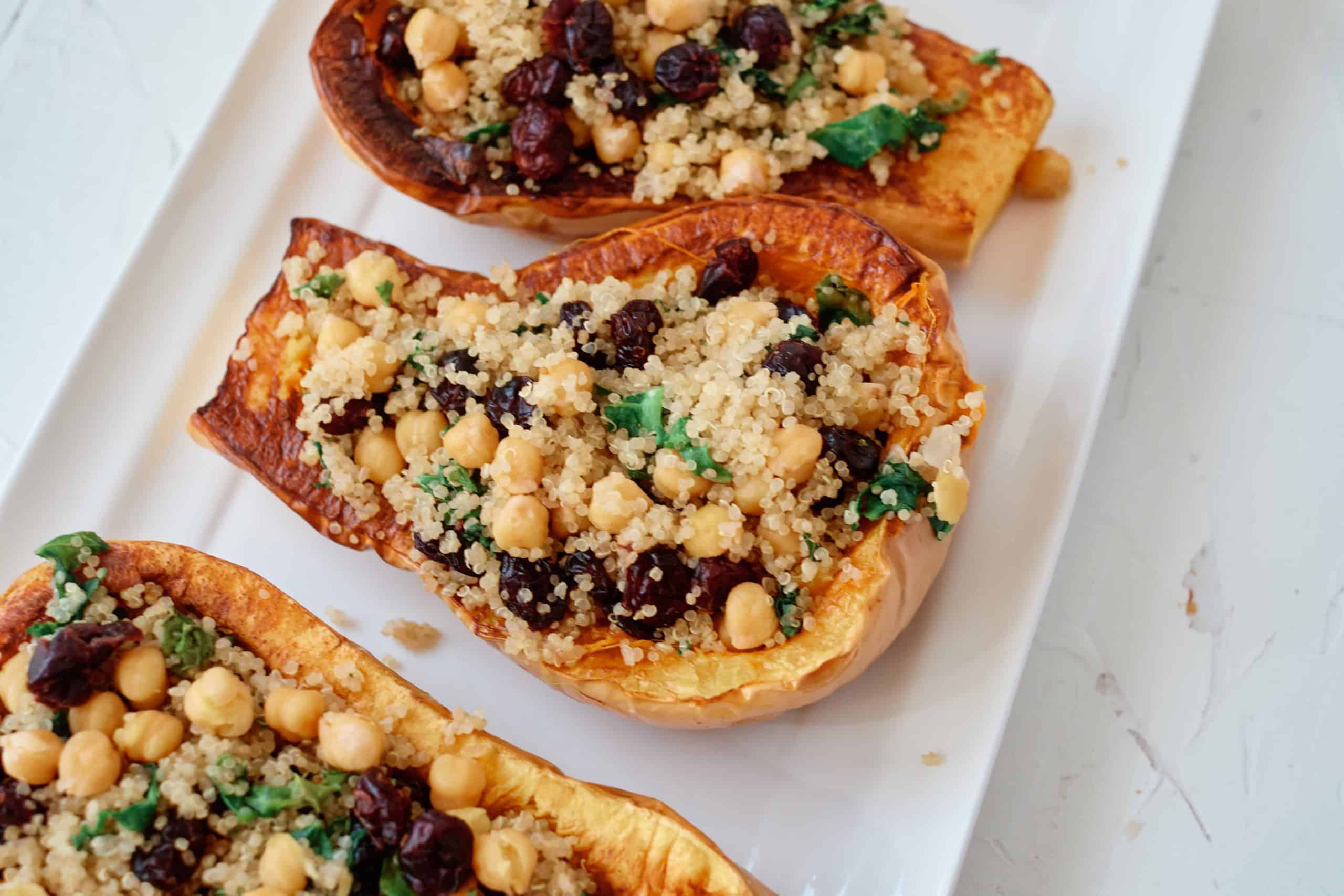 Quinoa Stuffed Butternut Squash on a white serving platter.