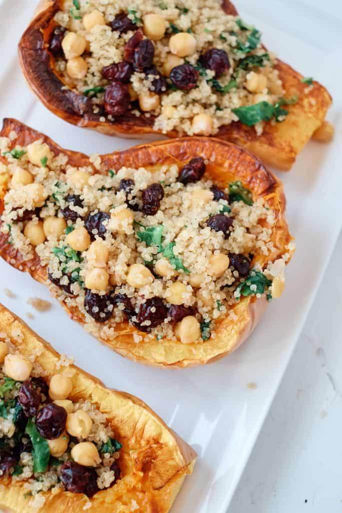 Quinoa Stuffed Butternut squash on a rectangle white platter.