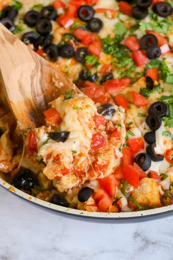 Closeup of Tex Mex Chicken on a wooden spoon.