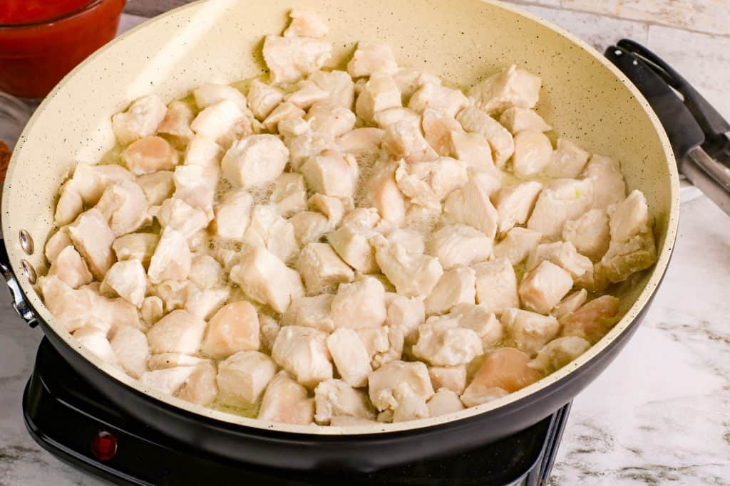 Chicken in a saut&eacute; pan.