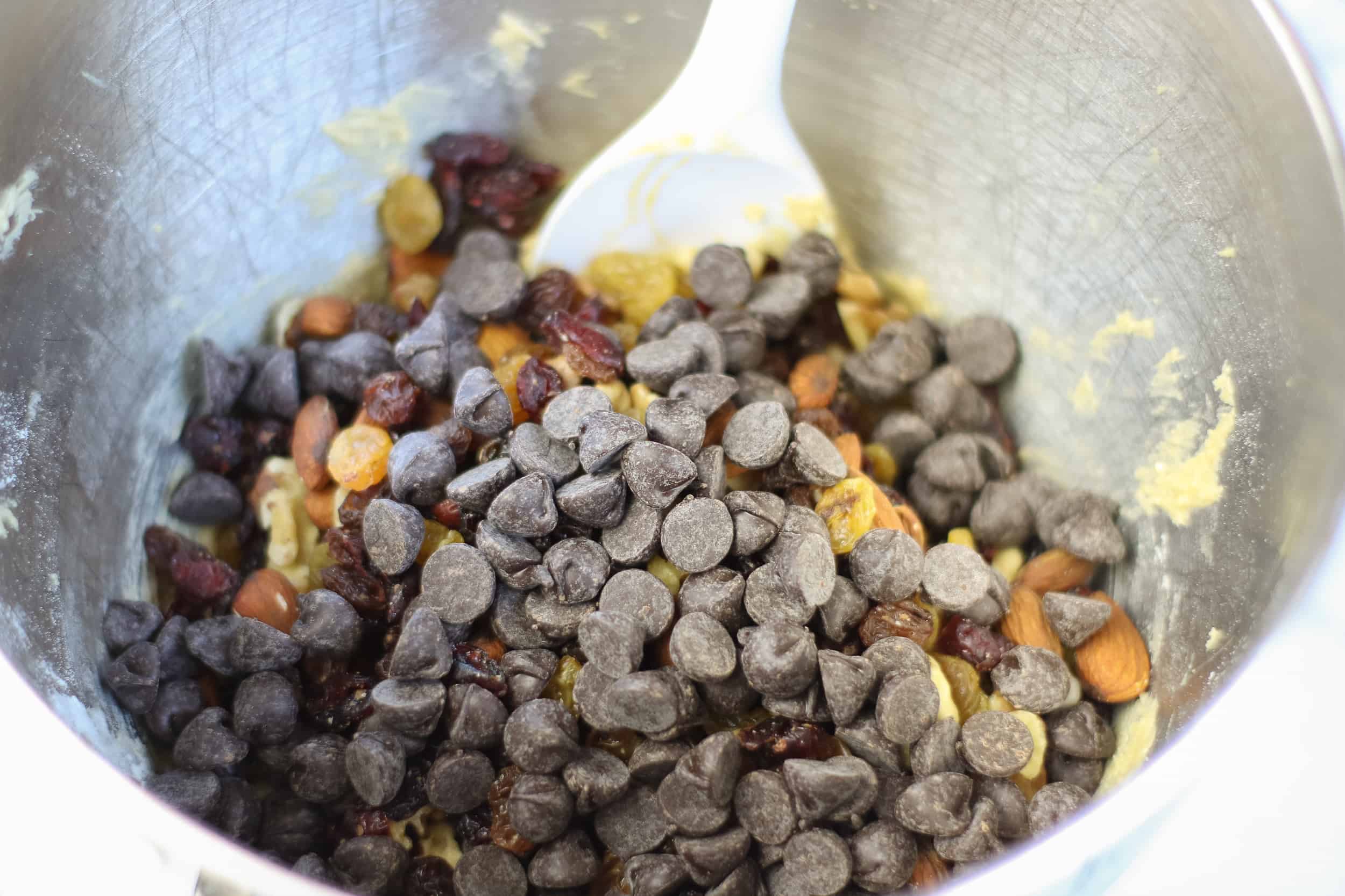 Chocolate Chips and Trail Mix on top of cookie dough.