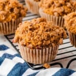 Closeup of pumpkin muffins on a cooling rack.