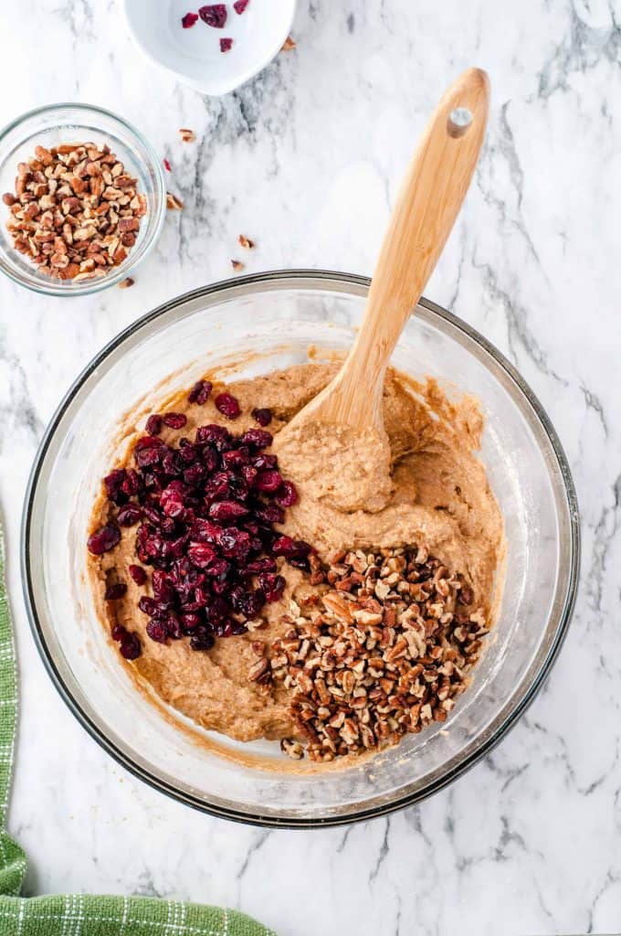 Cranberries and nuts on top of bread batter.