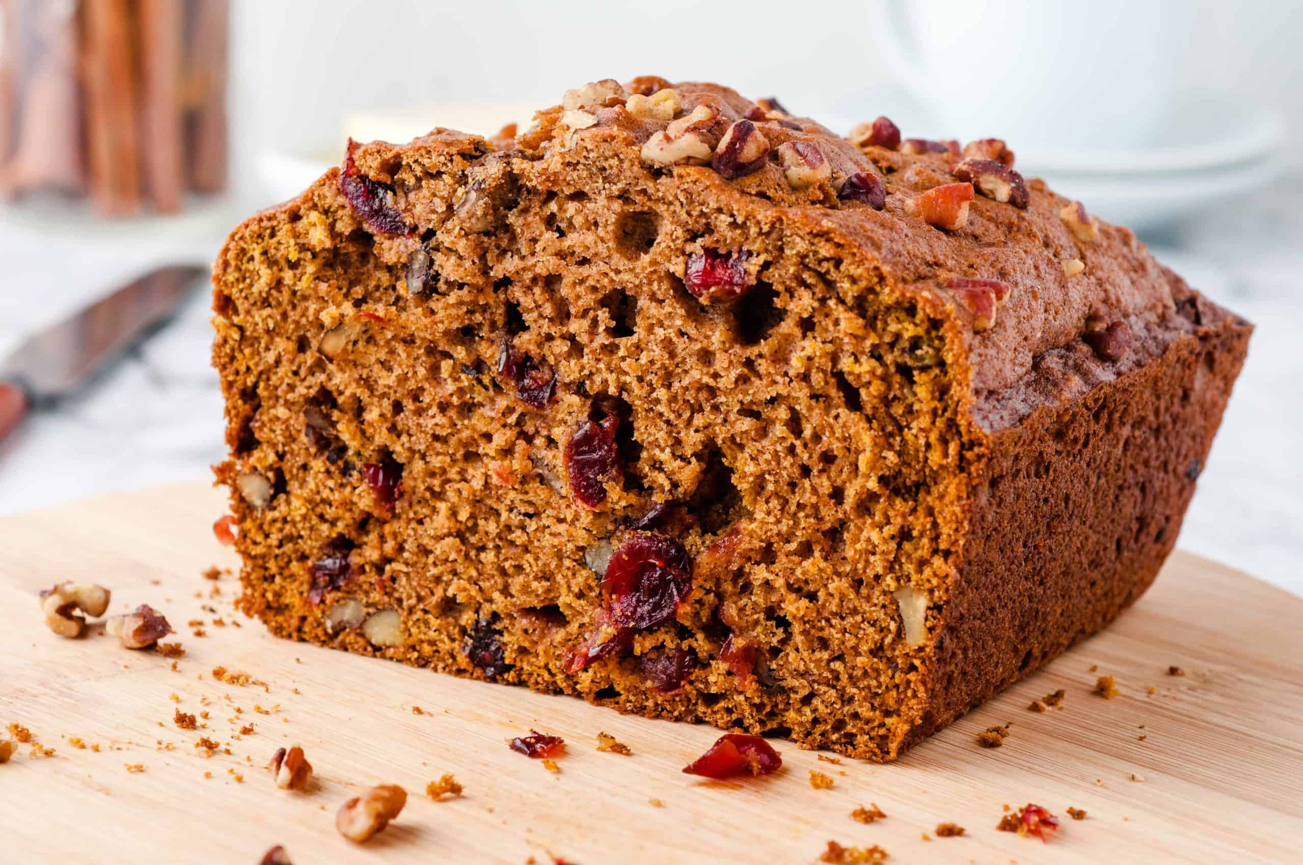 Cranberry Pumpkin Bread on a wood cutting board