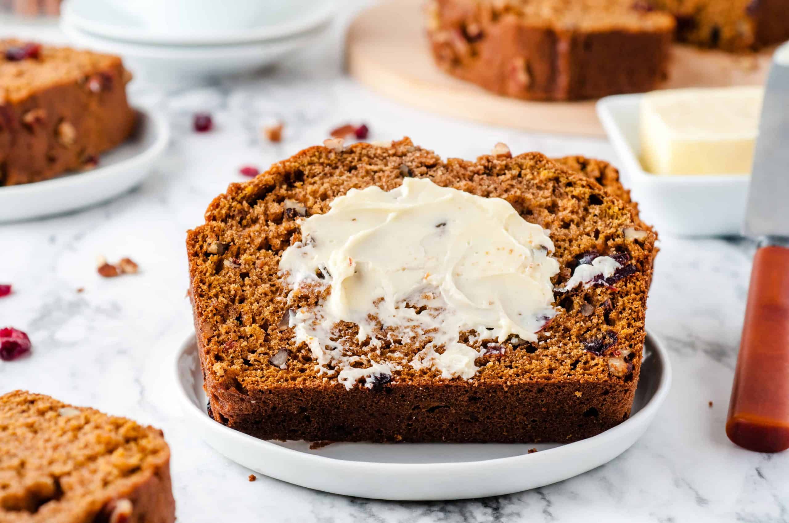 slice of pumpkin bread with butter.
