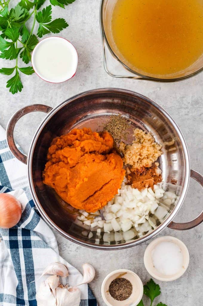 Soup ingredients in the bottom of a large pot.