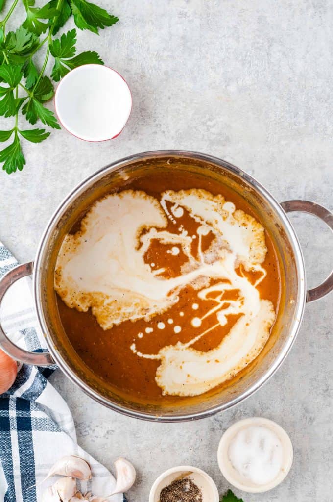 Pumpkin soup with heavy cream on top.