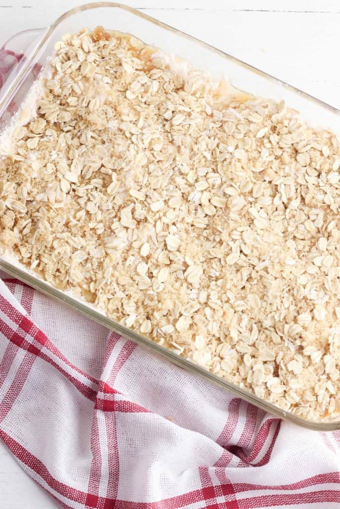 Apple crumb topping on top of cake, ready for the oven!