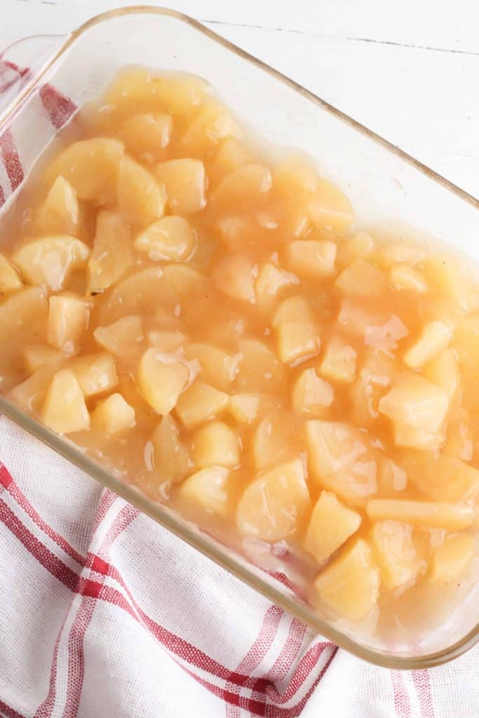 Apple pie filling in a glass baking dish,