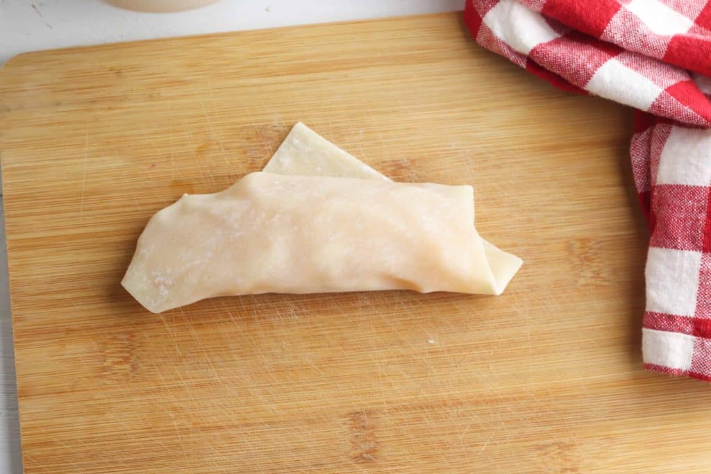 Apple Pie Egg roll on cutting board