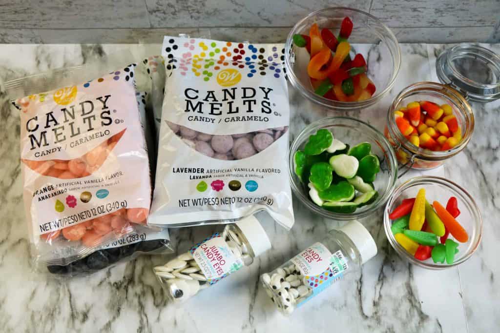 Candy Melts and various candies on a marble background.