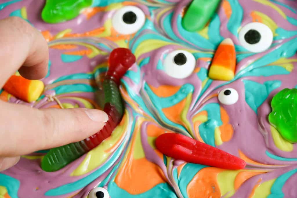 Pressing candy into the bark.