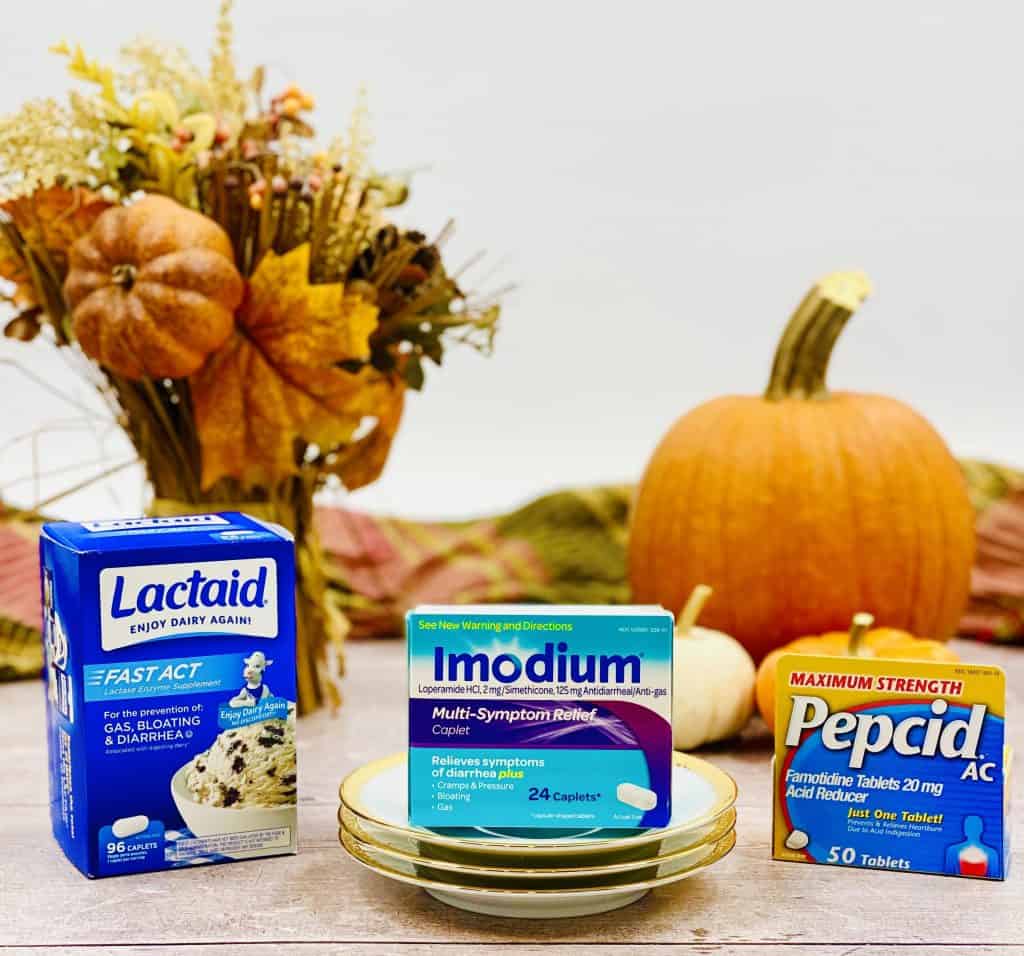 Lactaid, Immodium and Pepcid with at Thanksgiving themed background.