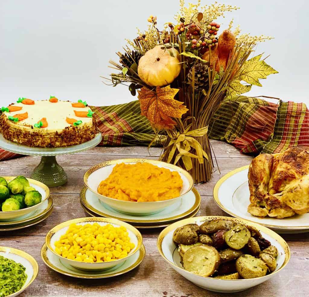 Thanksgiving feast spread out on a rustic wood background.