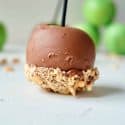 Chocolate dipped apple with peanuts