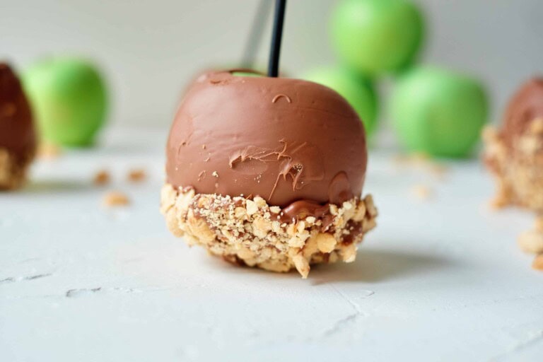 Chocolate dipped apple with peanuts