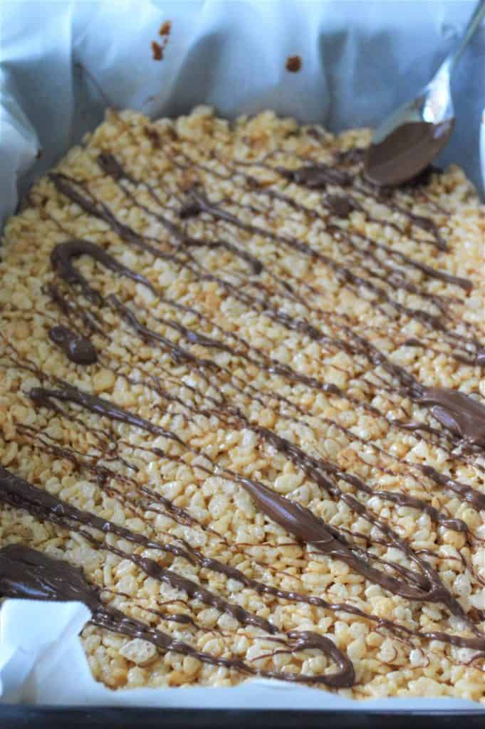 Rice Krispie with chocolate drizzled on top.