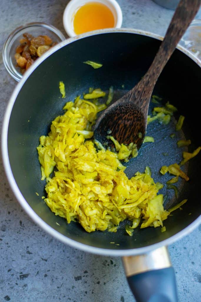 Shredded pumpkin in a saucepan.