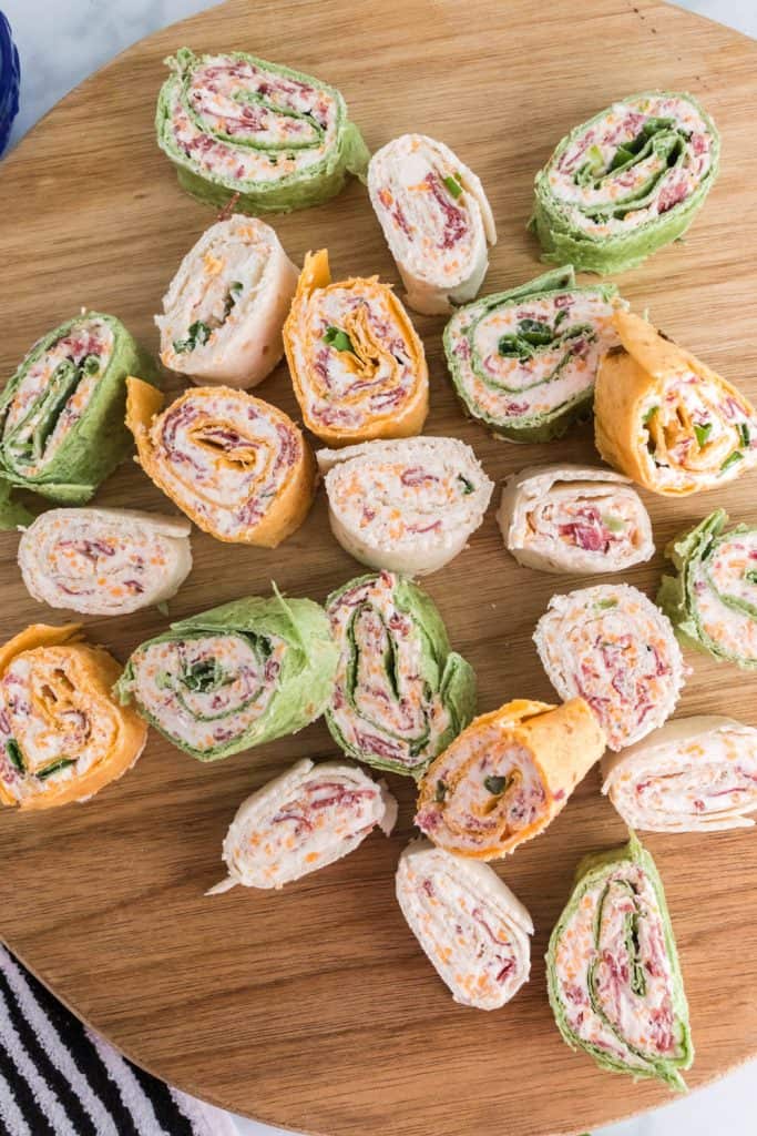 Pinwheels on a wood cutting board.