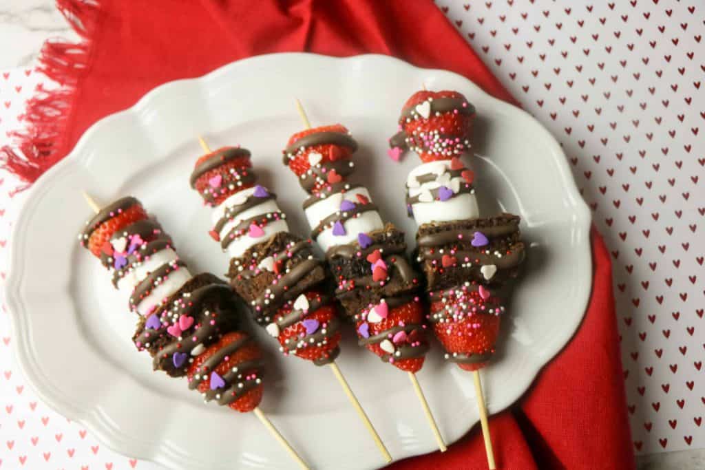 Strawberry Brownie Kabobs on a white platter.