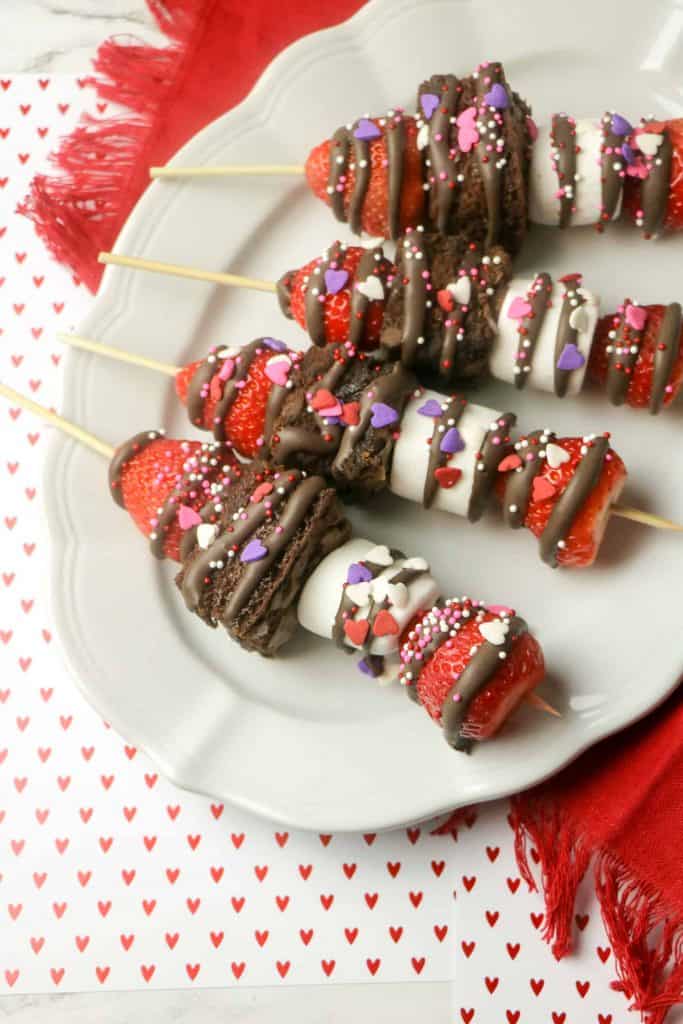 Chocolate Strawberry Dessert Sticks on a white platter.