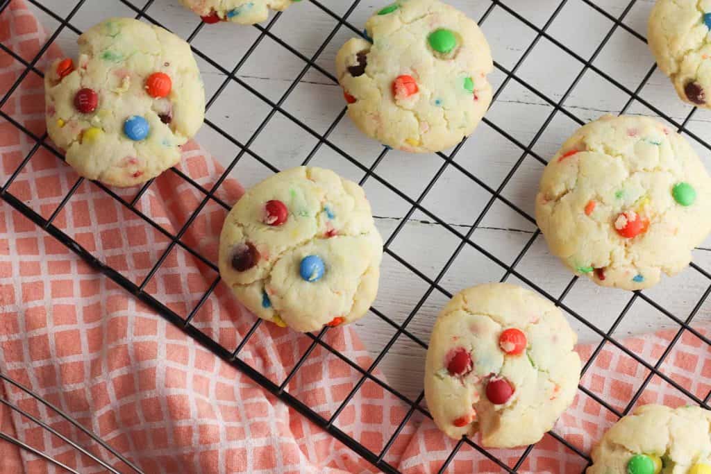 M & M Cookies on a wire rack.