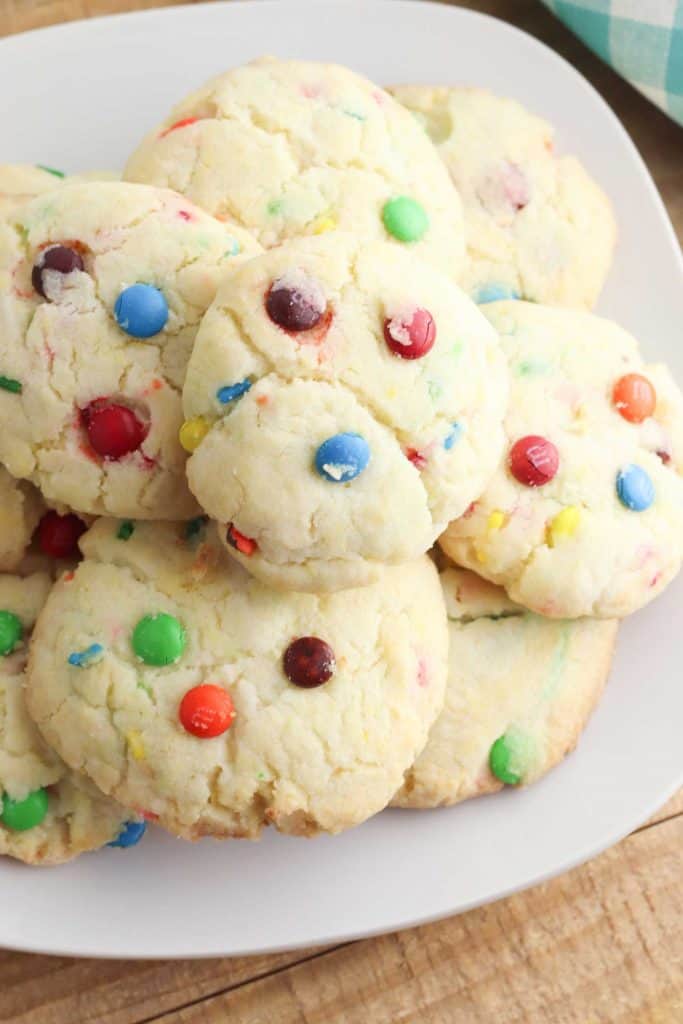 Gluten free Funfetti Cookies stacked on a white plate.