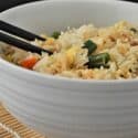 Instant Pot Fried Rice in a white bowl with chopsticks.