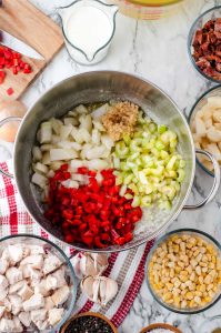 Onion, red pepper, garlic and celery in a saute pan.