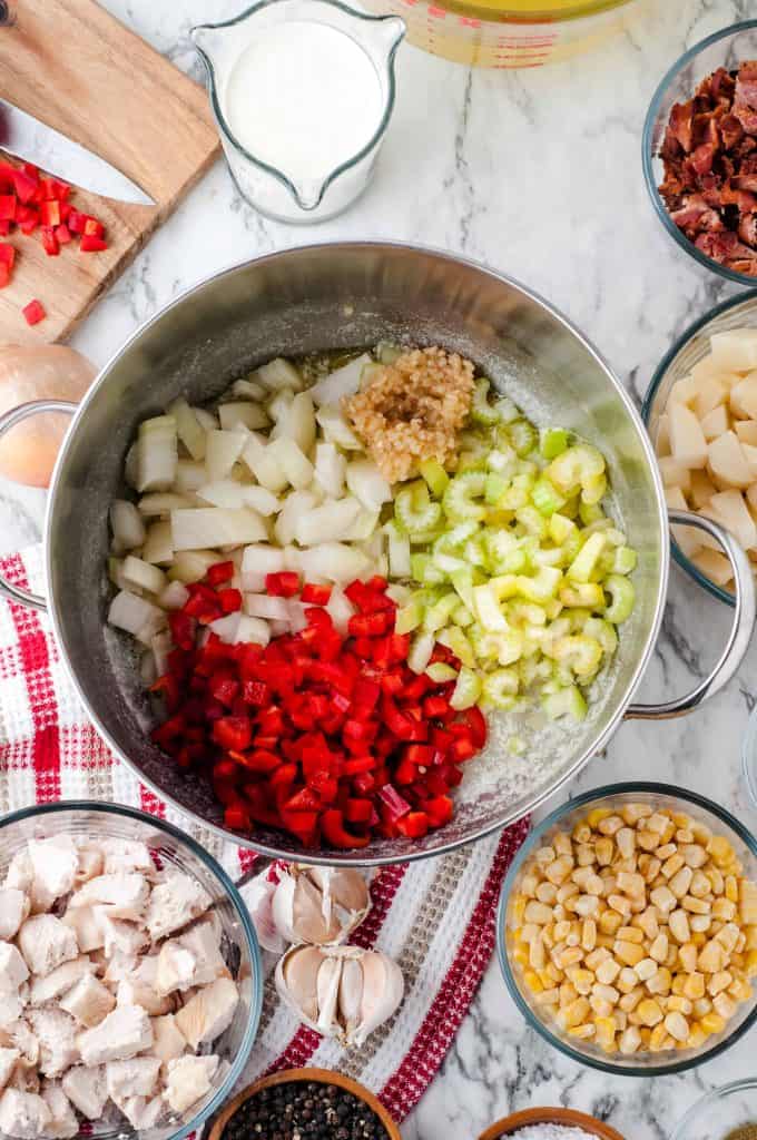 Onion, red pepper, garlic and celery in a saute pan.
