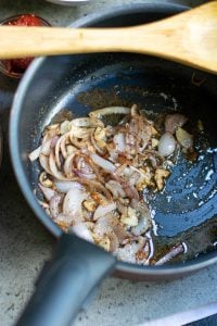 Onions, garlic and spices saut&eacute;ed in a large stock pot.