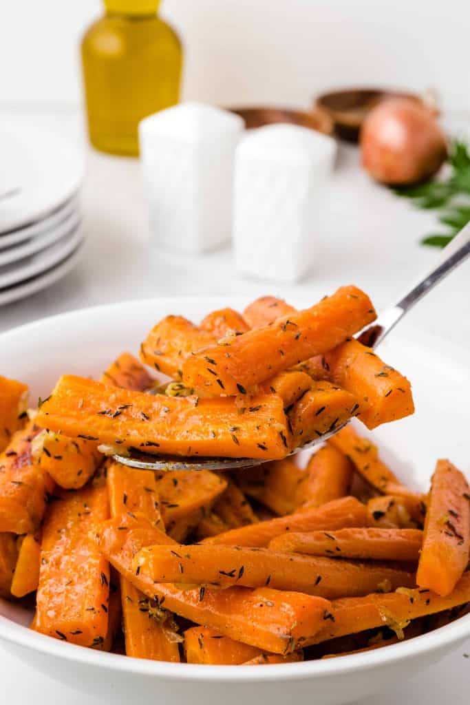 Savory roasted carrots with onions and thyme. being served.
