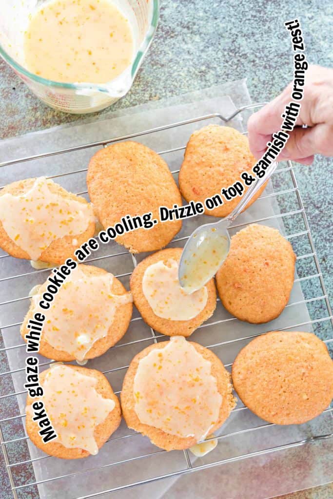 Orange glaze being drizzled onto carrot cookies.