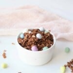 Homemade chocolate granola in a white bowl.