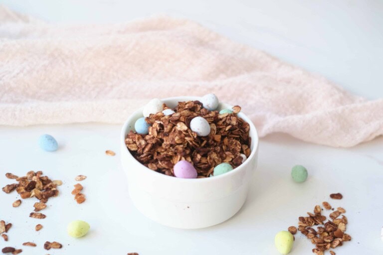 Homemade chocolate granola in a white bowl.