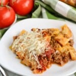 Closeup of cabbage casserole on a white plate.