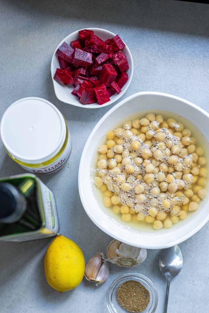 Overhead view of ingredients for homemade roasted beet hummus.