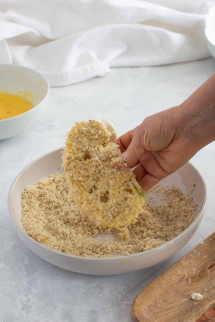 Dredging cauliflower in Panko.