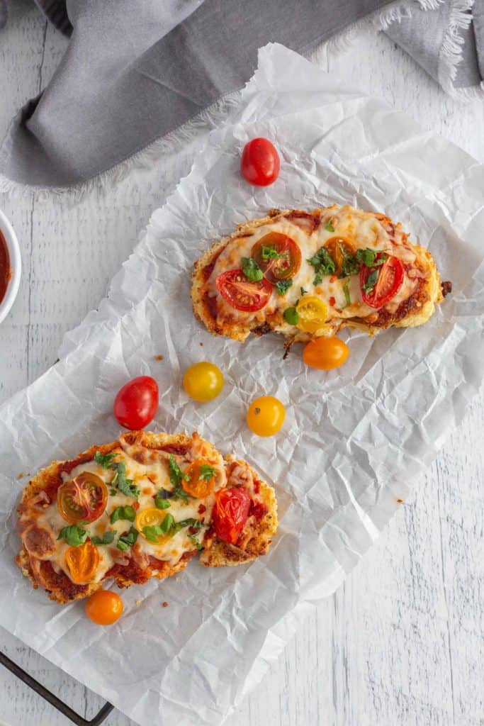 Cauliflower Parmesan on white parchment paper.