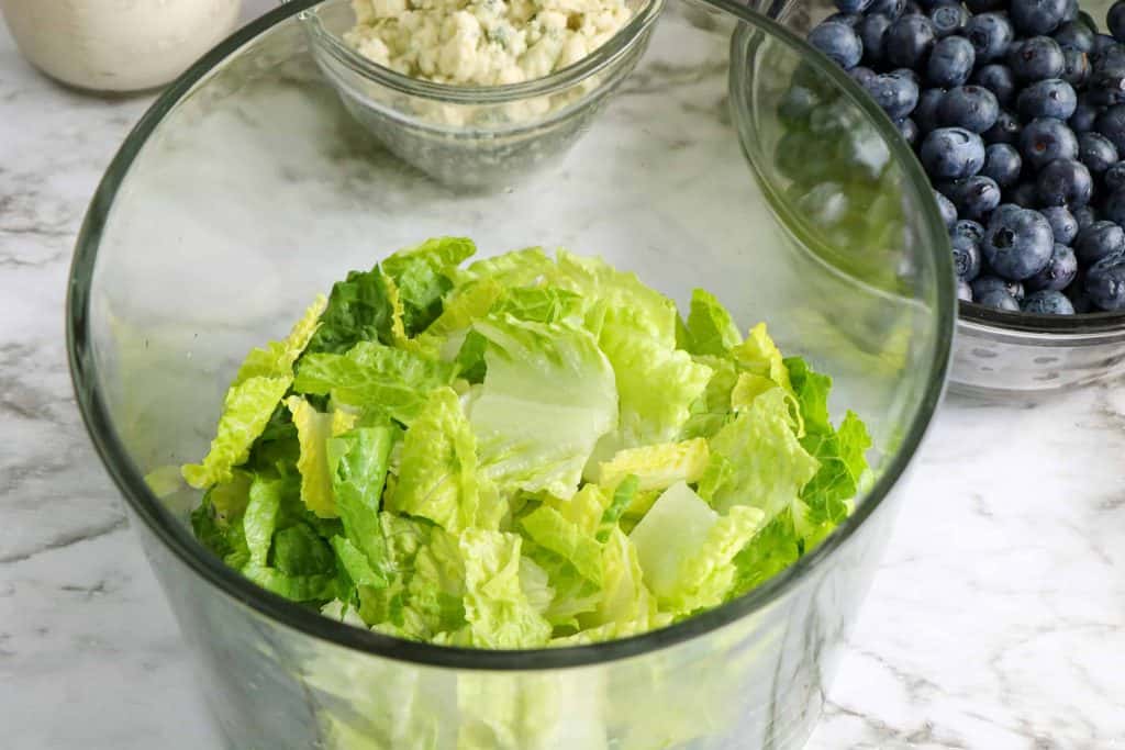 Lettuce in bottom of trifle bowl.