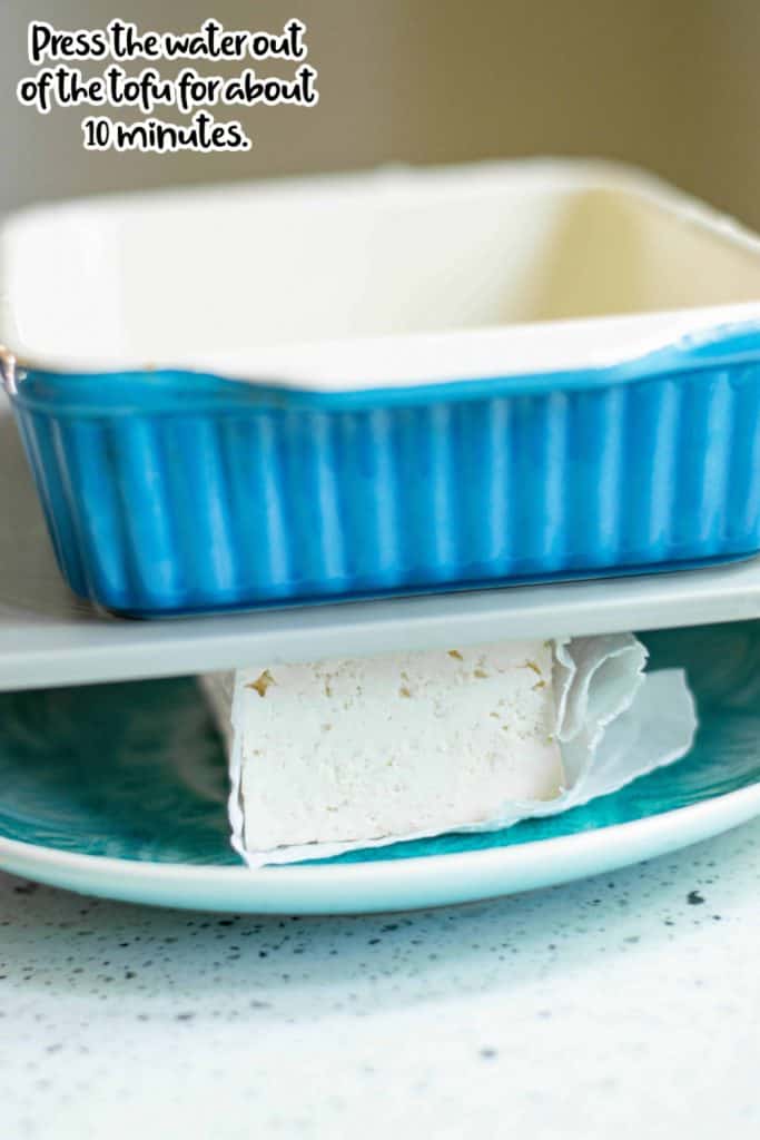 Water being pressed out of the tofu.