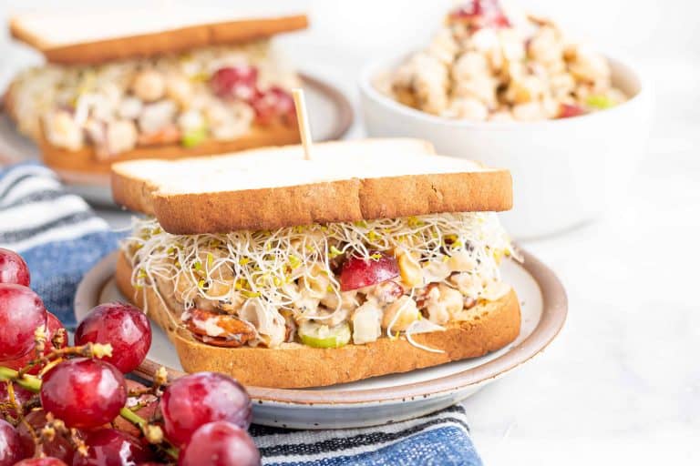 Head on view of Sonoma Chickpea Salad Sandwich with a second sandwich behind the first one.